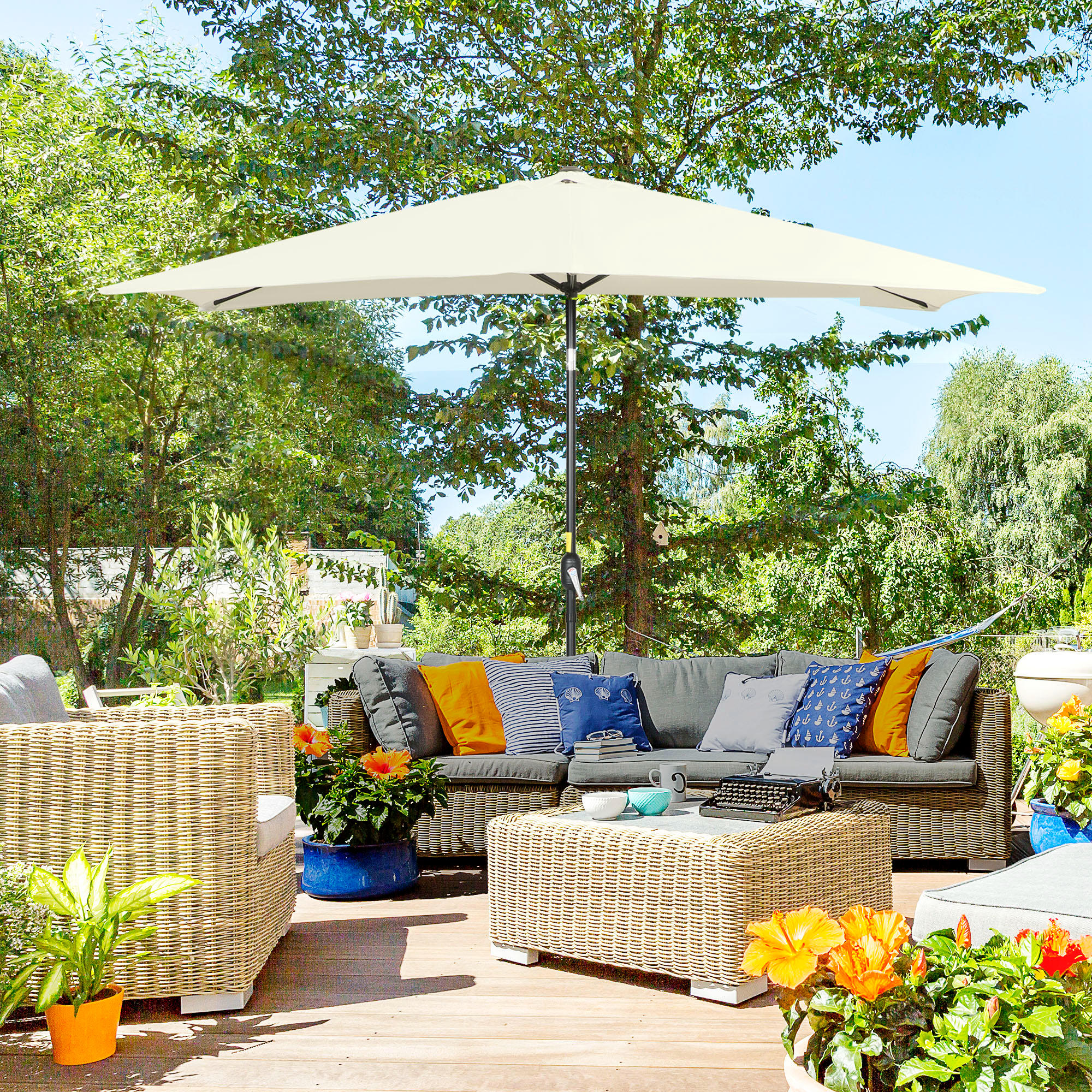 Spacious villa terrace with rattan furniture
