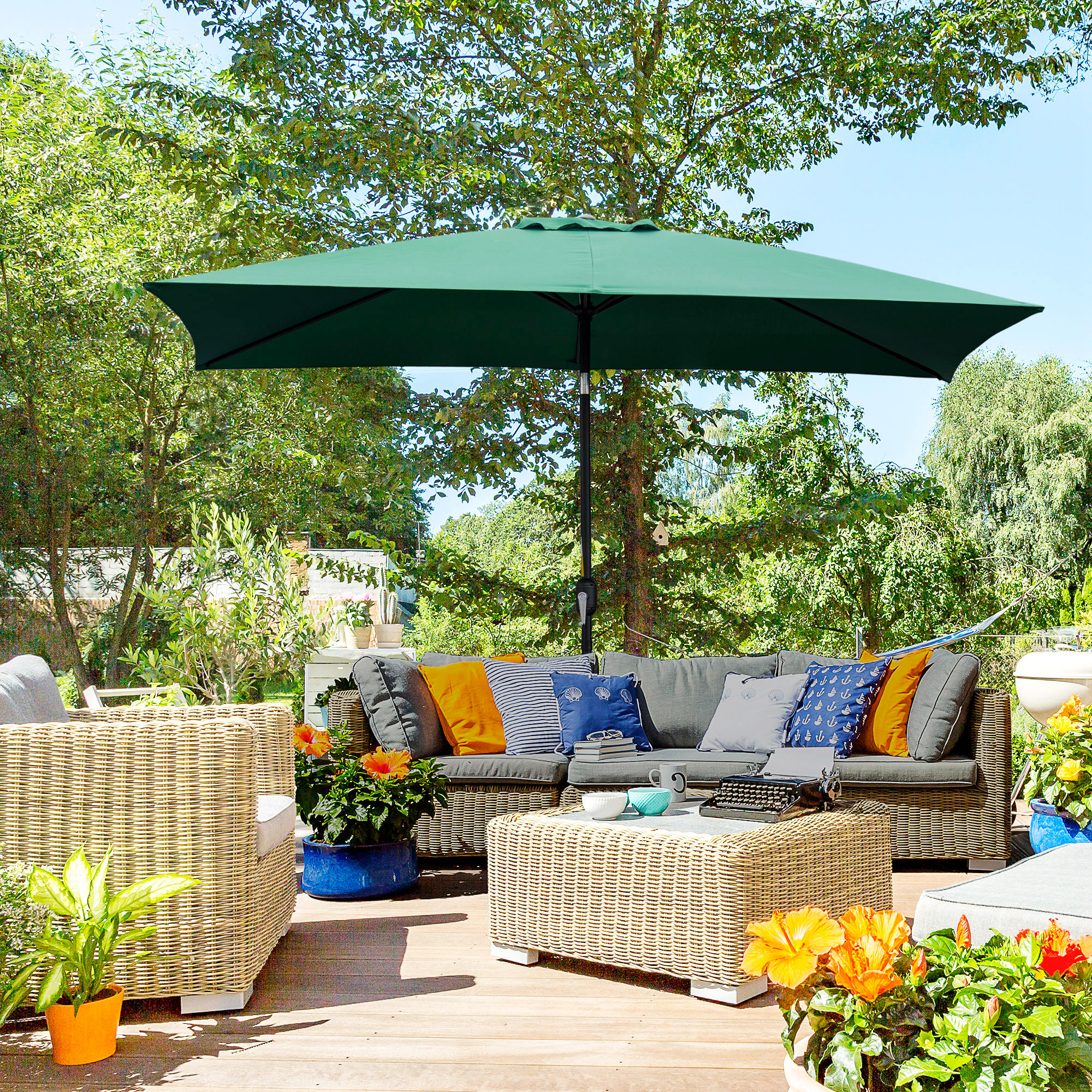 Spacious villa terrace with rattan furniture